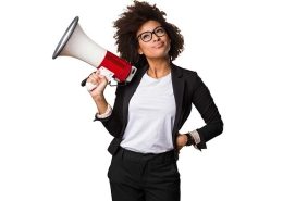 A woman with a megaphone communicating brand tone and voice in brand strategy